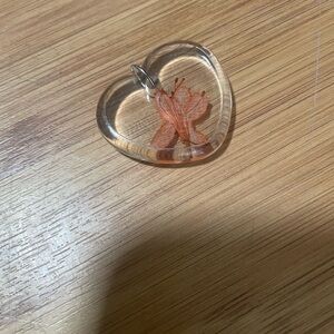 Heart-Shaped Pendant with Orange Flower